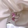 a pink ring with a heart shaped stone